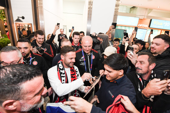 Juan Mata receives a warm welcome from Wanderers fans on arrival at Sydney airport.