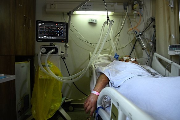 A man, who has been in a coma for 10 days from chemical and smoke inhalation from an Israeli airstrike, is treated in the intensive care unit at the Nabih Berri Governmental University Hospital in Nabatiyeh.