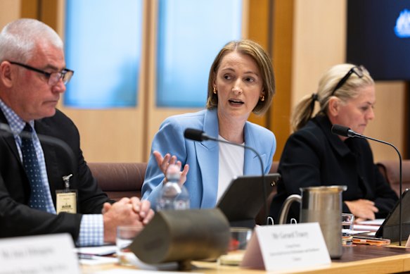 Telstra chief executive Vicki Brady (centre) at the inquiry on Tuesday.
