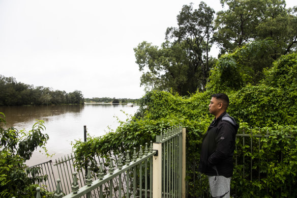Chipping Norton resident Jason Nguyen in his backyard looking out over Georges River.