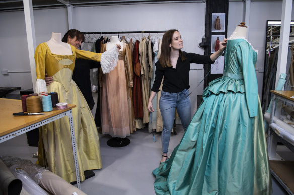 Owner of the Sydney Costume Workshop, Leonie Grace and costume associate Jude Loxie with wardrobe items from the musical Hamilton.