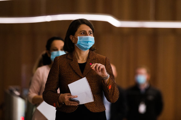 Gladys Berejiklian enters the COVID-19 briefing on Wednesday.