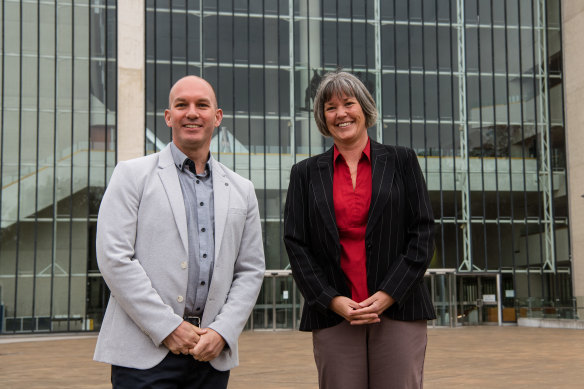 Electric vehicle owners Chris Vanderstock and Kath Davies outside the High Court.