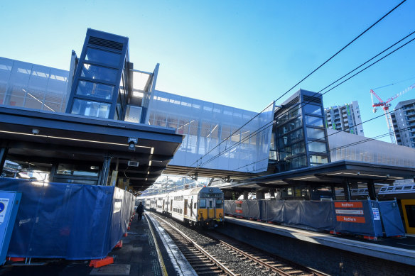 The new pedestrian bridge stretches across busy rail lines at Redfern station, providing lift access to platforms.