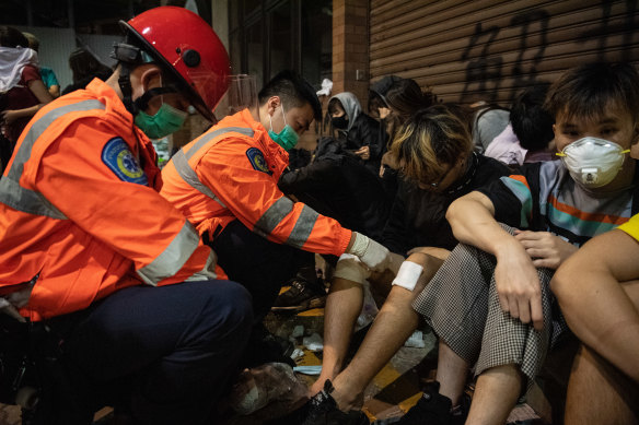 Injured anti-government protesters are treated by medics at Hong Kong Polytechnic University last month.