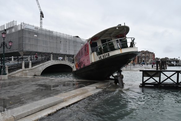 A stranded ferry in flood-hit Venice.