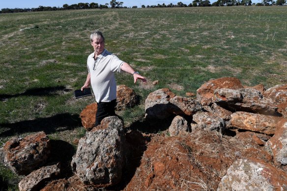 Landowner Adrian McMaster points to the rocks the removed in April 2021. He’s since commissioned a report that says the arrangement is not a sacred Aboriginal site.