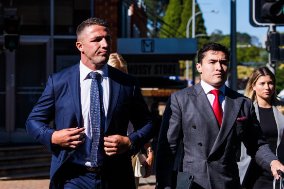 Former rugby league star Sam Burgess, left, arrives at Moss Vale Local Court.