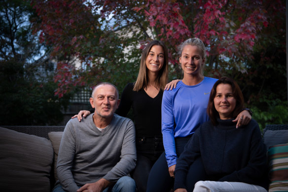 Hana Basic (wearing blue) with sister Mia and parents Zana and Armin. 