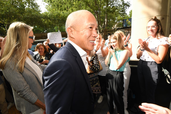 Controversial neurosurgeon Charlie Teo is greeted by supporters as he arrives at a disciplinary hearing into his procedures.