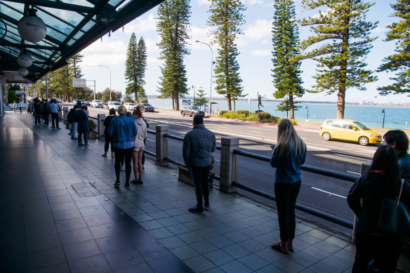 Long lines around the block in Sydney’s Brighton-Le-Sands as under-39s registered for Pfizer vaccines wait to receive their dose.