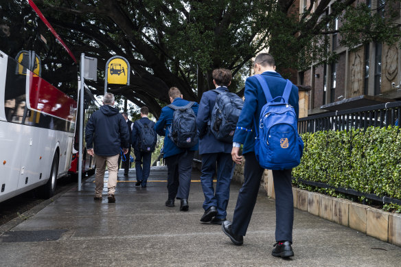 Waverley College students leave school after a student tested positive to COVID-19 on Tuesday.