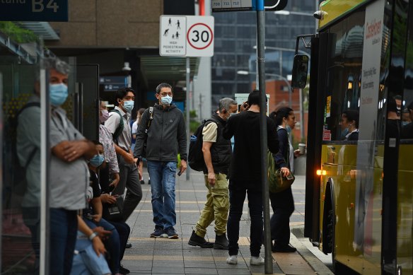 Commuters wait for buses at Parramatta Station.