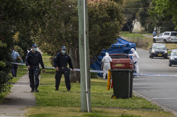 Police on William Street, Blacktown, on Thursday morning after an 18-year-old man was fatally stabbed. 