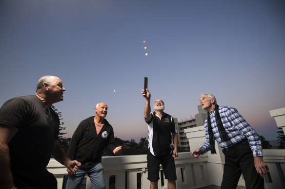 Sean Dry and friends Tim Reilly, Steve Woodley and Phil Nicol playing two-up last year ahead of Anzac Day. 