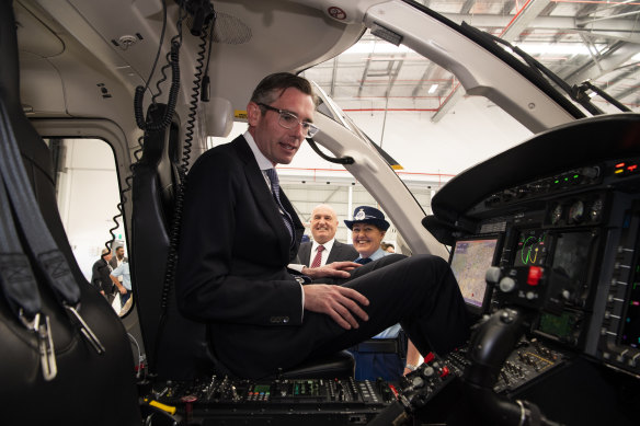 Mr Perrottet doing what politicians do best: trialling new gear. This time it was unveiling new police helicopters.