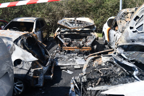 Firefighters were called to Sydney Airport where flames had engulfed five cars.