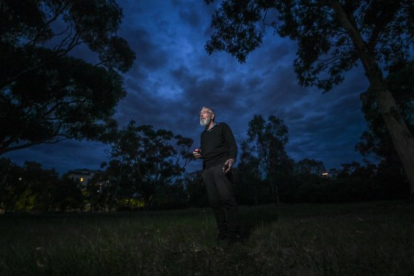 Dr Barry Clark measuring light levels in Royal Park.