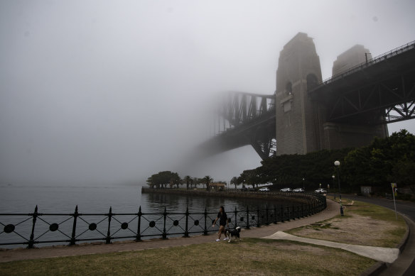 The Sydney Harbour Bridge disappeared into thick fog this morning.