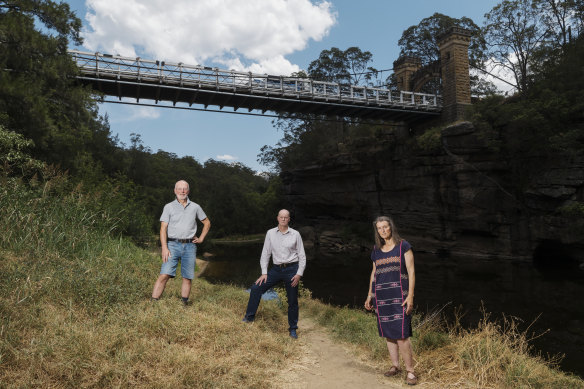 Kangaroo Valley residents Gary Moore, Matt Gray and Kate Watson beneath the Hampden Bridge. 