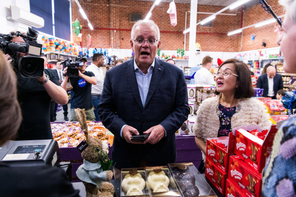 Australian Prime Minister Scott Morrison visits Wallies Lollies in the seat of Chisholm with local MP Gladys Liu. 