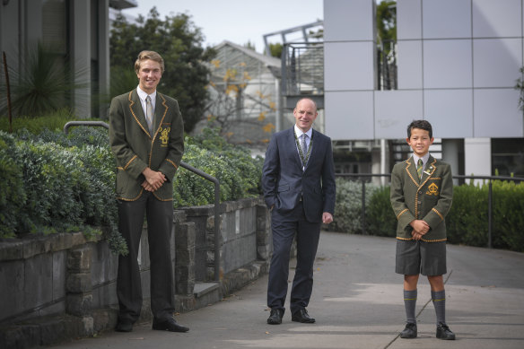 Trinity Grammar principal Adrian Farrer with school captain Jack Stewart and junior school captain Wes Collins. 