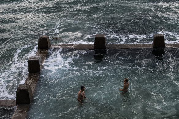 Swimmers practise social distancing in the ocean pool at Coogee. 