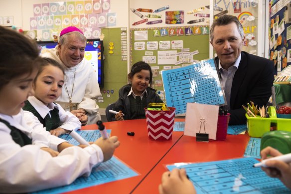 Education Minister Jason Clare visits St Felix Catholic Primary in Bankstown on Tuesday with Sydney Catholic Archbishop Anthony Fisher.