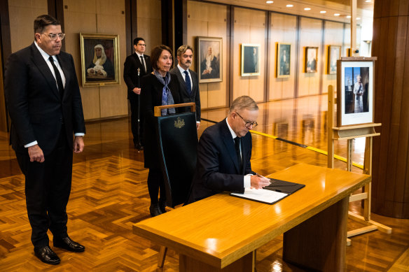 Prime Minister Anthony Albanese signs the Book of Condolences at Parliament House in Canberra.
