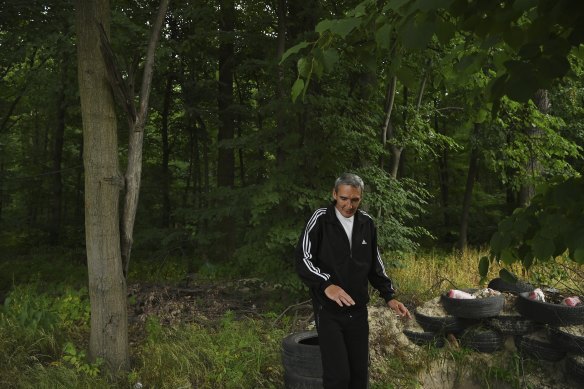 Boris Popov stands in the forest glade where he was captured by the Russians. 