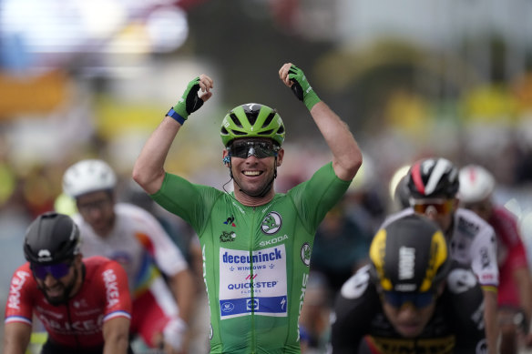 Britain’s Mark Cavendish celebrates as he crosses the finish line to win the tenth stage of the Tour de France. 