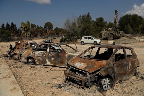 Destroyed vehicles in the Israeli kibbutz of Kfar Aza, which was attacked by Hamas on October 7.