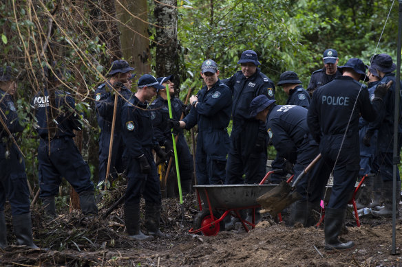 Police and specialists search a site in Kendall last month.