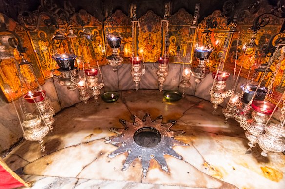 A silver star marks the traditional site of the birth of Jesus in a grotto underneath Bethlehem’s Church of the Nativity, Palestine. 