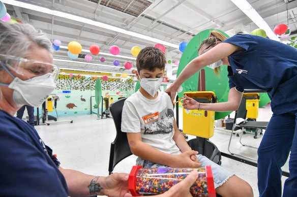 Kato Di Natale,10, gets his jab at  Frankston Community Vaccination Hub yesterday. 