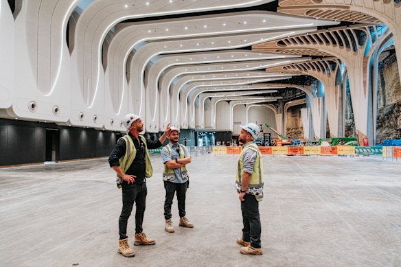 Construction workers at the cavernous Cutaway, which is due to open for events at Barangaroo this year. 
