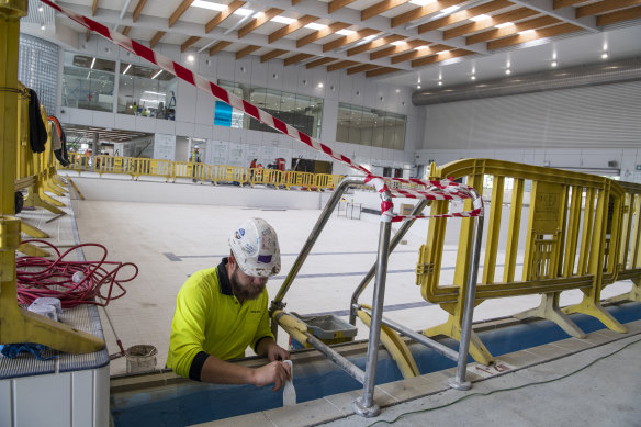A worker in the indoor swimming area of the new Ashfield Aquatic Centre.