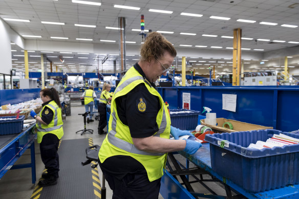 Officers inspect mail visually and physically to detect any illicit items. 