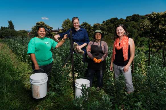 Green Connect Farm in Lake Heights, south of Wollongong has helped refugees and other gain employment. Standing left to right: Su Meh, Emily Henderson, Pleh Meh and Kylie Flament, general manager of Green Connect. 