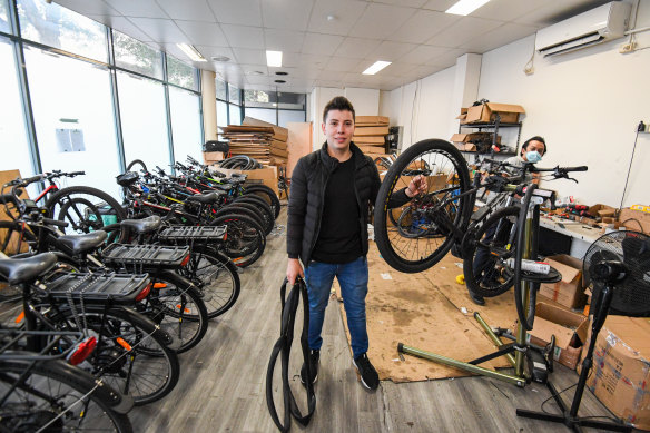 Andres Puerto from Colombia is making a living renting e-bikes but says his fellow international students are struggling.