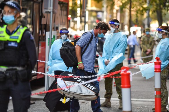 A man arrives at hotel quarantine on Thursday morning.