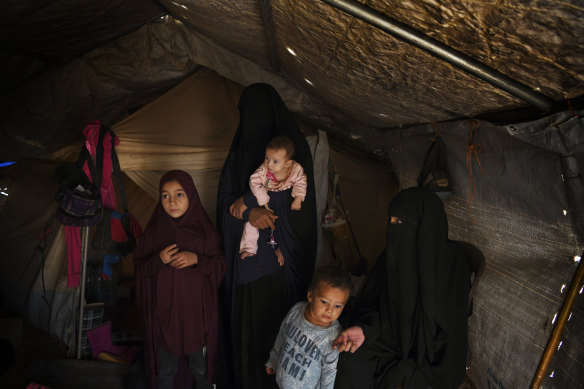 Australian’s Maysa Assaad aged 9 years old (left), Bassama Assaad (2nd from left) holding Shayma Assaad’s daughter Mariam (3rd from left), Shayma Assaad’s son Dawood (2nd from right) and Shayma Assaad (right) in al Hawl camp in North East Syria. 