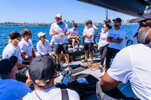 A team meeting onboard LawConnect on Sydney Harbour on Tuesday. 