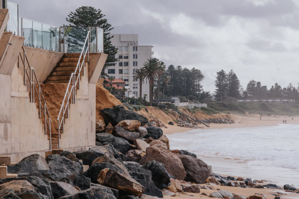 The private seawall filled with sand with beach erosion below along the Collaroy beachfront.