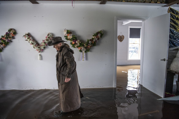Londonderry resident Janette Shute photographed in her friend Leanne Dalrymple’s flooded home.