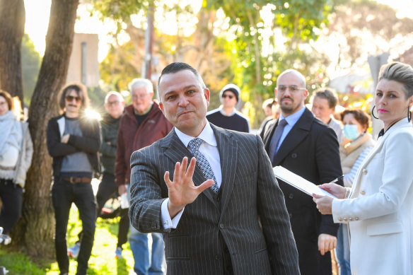 Auctioneer Clarence White in action at 65 Windsor Road Dulwich Hill, which sold for $2.41 million.