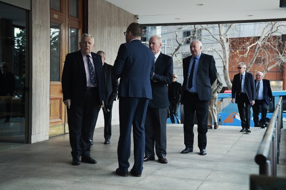 Men arrive at the men’s only Australian Club to vote on whether women can be admitted as members.