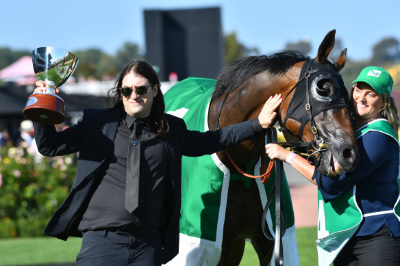 Matthew Gudinski with Homesman, which was owned by his father Michael Gudinski, after the Australian Cup victory on Saturday.