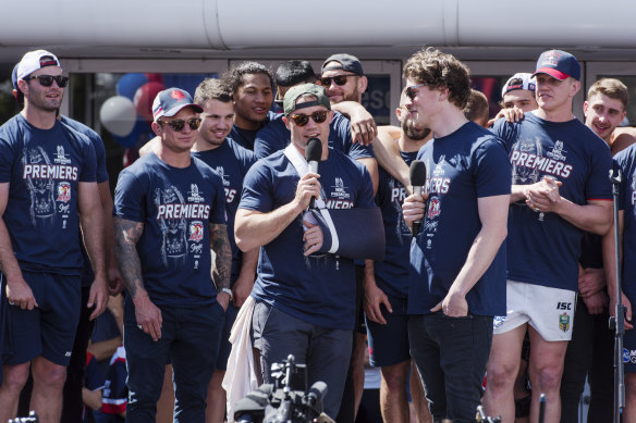 Cooper Cronk in a sling after the 2018 Grand Final win.