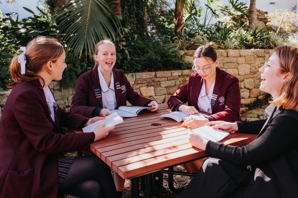 St Clare’s College Waverley  head English teacher Mary Prince with year 11 English students Suki Waddel, Emily Cleary and Helena Phoon.